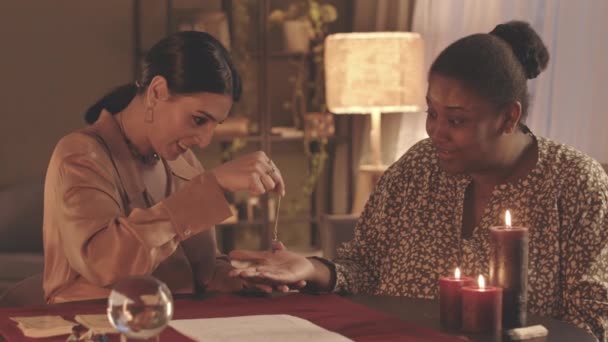 Waist Slowmo Fortune Teller Using Pendulum Hand African American Woman — Stock Video
