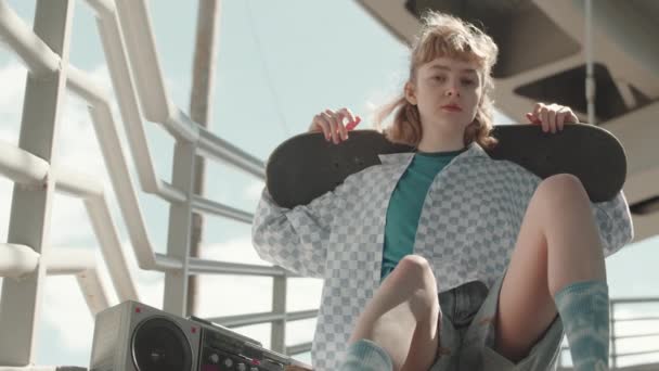 Medium Slowmo Caucasian Girl Vintage Old School Outfit Holding Skateboard — Stock Video