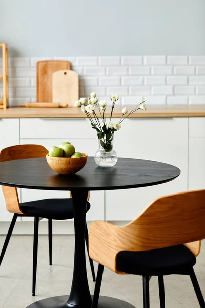 stock image Elegant black table with two wooden chairs in modern kitchen interior, copy space