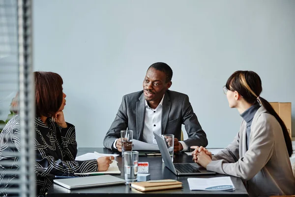 Portrait Young Black Businessman Talking Team Meeting Office Pale Blue — Stock Photo, Image