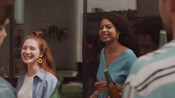 Medium Slowmo Cheerful Multiethnic Friends Toasting Beer Bottles Dancing Music — Stock Video
