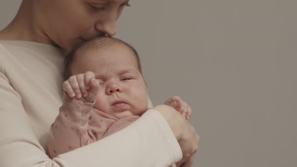 Medium Closeup Slowmo Young Caring Mother Holding Her Sleepy Newborn — Stockvideo