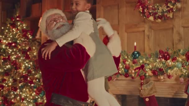Slowmo Bearded Santa Red Costume Lifting Embracing Pretty Little African — Video Stock