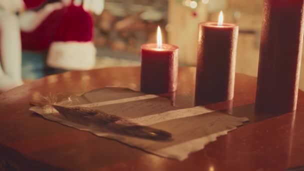 Slowmo Closeup Handwritten Letter Santa Wooden Table Candles Cozy Living — Vídeo de Stock