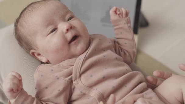Slowmo Closeup Beautiful Smiling Baby Girl Lying Mother Laps Exploring — Stockvideo