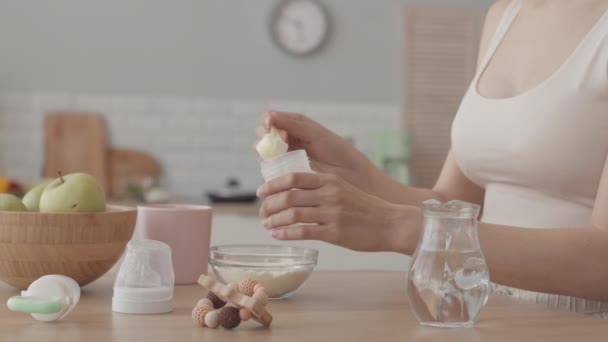 Cropped Slowmo Young Caring Mother Preparing Baby Formula Milk Bottle — Αρχείο Βίντεο