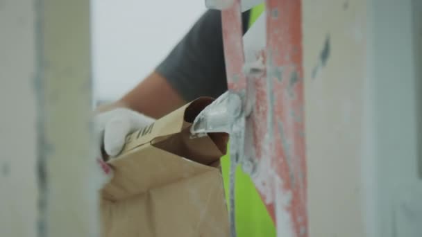 Closeup Unrecognizable Plant Worker Using Bags Processed Granite Aggregate Applying — стоковое видео