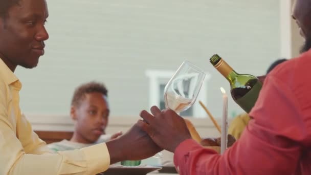 Rear View Waist Black Man Pouring Red Wine Guests Dinner — Stockvideo