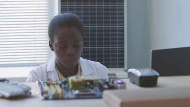 Serious African American Female Electronics Engineer Working Motherboards Solar Panels — Stockvideo