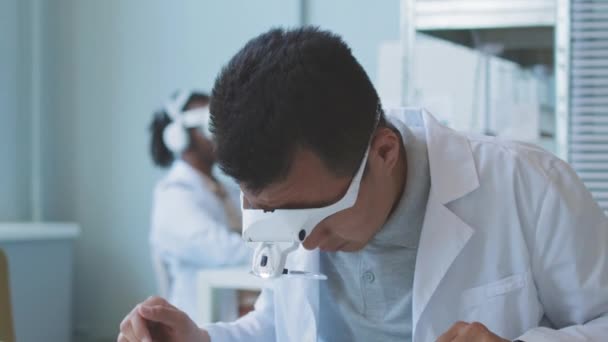 Asian Scientist Engineer Headband Magnifier Lab Coat Examining Motherboard While — Αρχείο Βίντεο