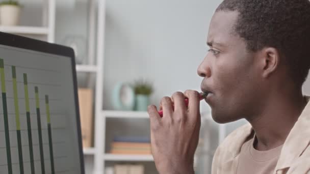 Side View Medium Closeup Slowmo Young Black Man Examining Business — Stock Video