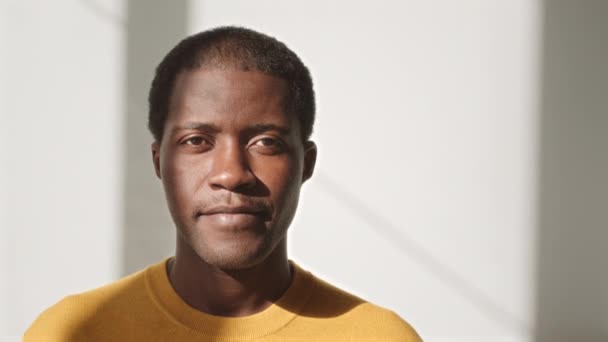 Medium Closeup Portrait Young Black Man Yellow Shirt Smiling Camera — стокове відео