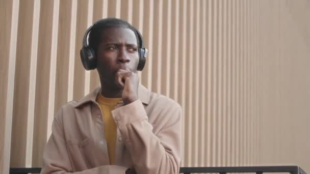 Waist Shot Young Black Man Headphones Listening Music Smoking Cigarette — Stok video