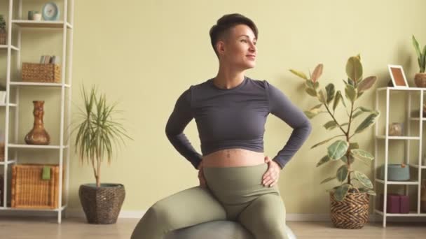 Medium Shot Young Modern Pregnant Woman Sitting Fitness Ball Doing — стоковое видео