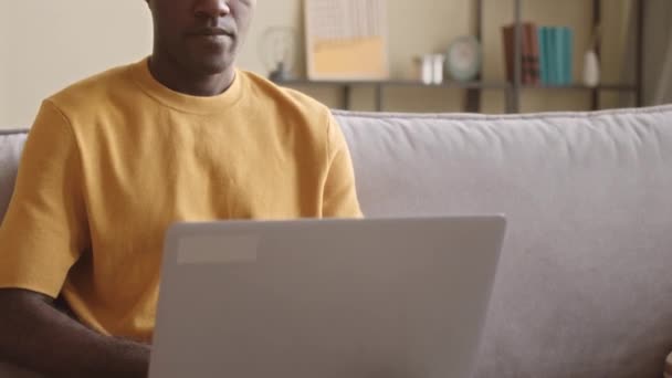 Tilt Shot Young African American Man Using Laptop Making Phone — 图库视频影像