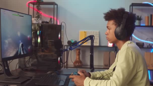 Medium Shot Biracial Teenage Boy Headphones Using Controller While Playing — Stock Video