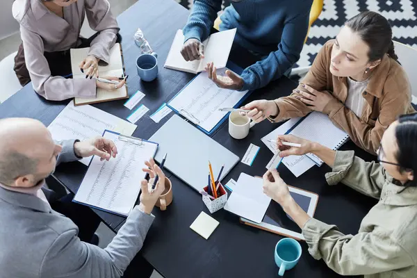 Top View Diverse Group People Meeting Table Office Setting Communicating — Stock Photo, Image