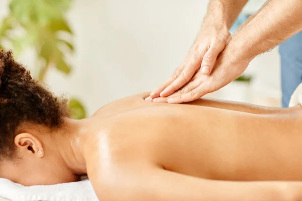 Side View Closeup Male Beautician Giving Back Massage Young African — Stock Photo, Image