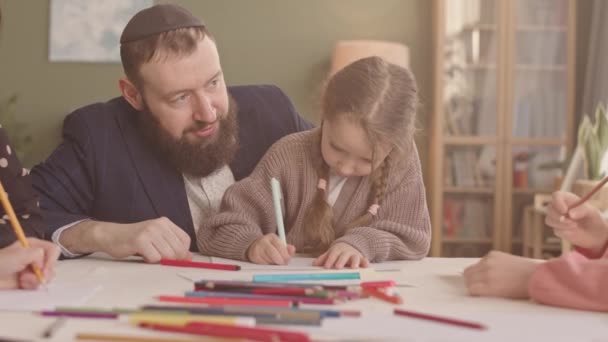 Happy Jewish Man Wearing Kippah Watching His Little Daughters Drawing — Stock Video