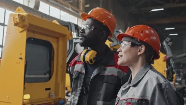 Multiethnic Colleagues Working Together Tractor Machine Production Plant Having Conversation — Stock Video
