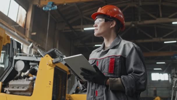 Caucasian Female Engineer Hard Hat Safety Glasses Using Tablet Computer — Stock Video