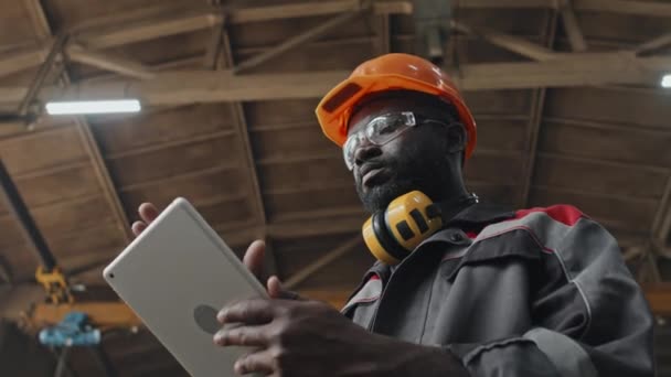 Low Angle African American Male Factory Worker Hard Hat Safety — Stock Video