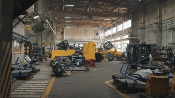 People Dolly Shot Modern Big Tractor Plant Producing Crawler Tractors — Video