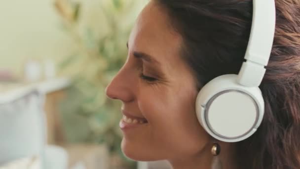 Close Young Beautiful Woman Enjoying Music Wireless Headphones Sitting Eyes — Stock Video
