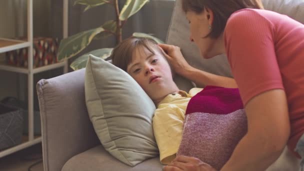 Caring Mother Taking Care Her Daughter Syndrome Napping Couch Living — Stock Video