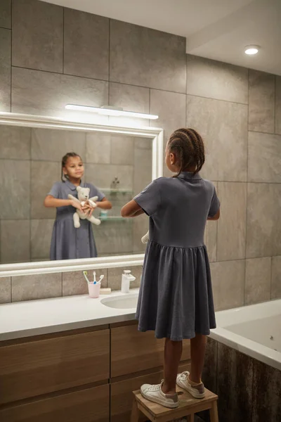 Back View Portrait Cute Black Girl Looking Mirror Bathroom Holding — Stock Photo, Image