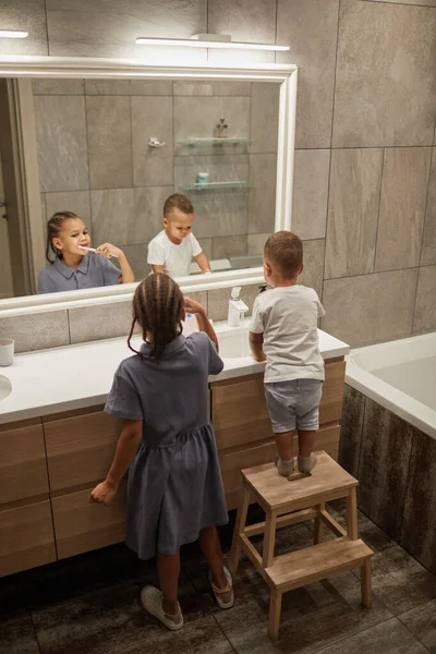 Vertical Portrait Two African American Kids Brushing Teeth Mirror Bathroom — Stock Photo, Image