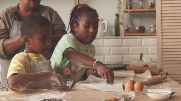 Two African American Tween Siblings Decorating Homemade Cookies Baking Sheet — Stock Video