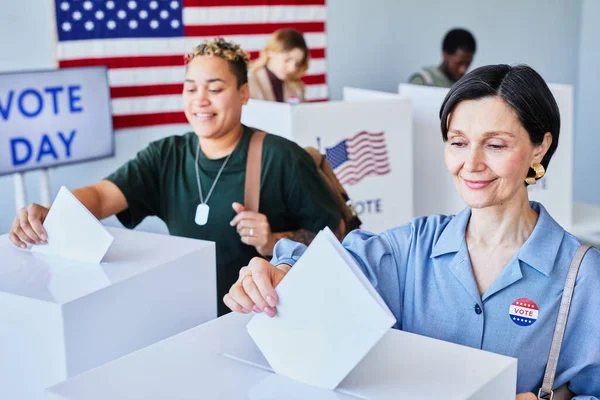 Portrait Two Smiling American Women Voting Putting Ballots Bins Election — Stock Photo, Image