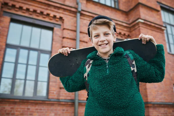 Portrait Teenage Boy Holding Skateboard Smiling Camera While Walking Outdoors — Stock Photo, Image