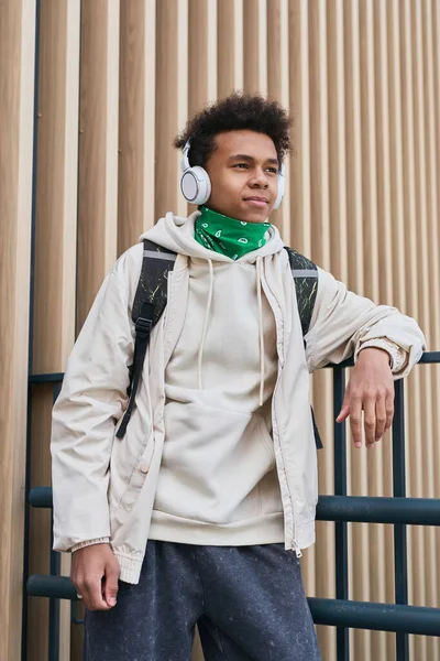 African Teenage Boy Casual Clothing Backpack Listening Music Wireless Headphones — Stock Photo, Image