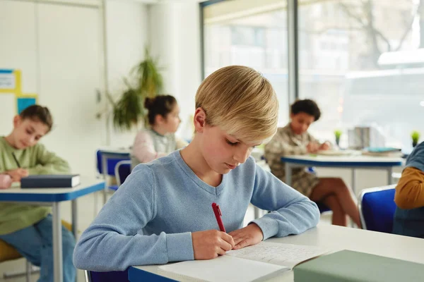 Portrait Blonde Schoolboy Writing Notebook School Class Children Background — Stock Photo, Image