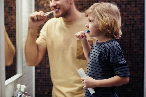 Side View Portrait Blonde Young Boy Brushing Teeth Bathroom Father — Stock Photo, Image