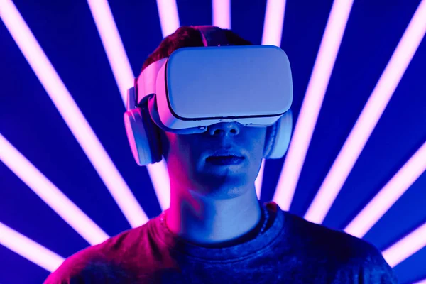 Futuristic Shot Young Man Wearing Headset Neon Light Beams Background — Stock Photo, Image