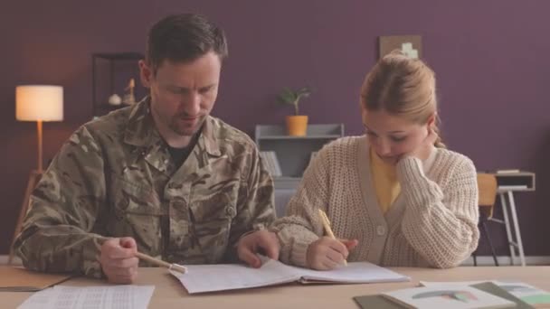 Waist Shot Army Officer Helping Little Daughter School Homework Sitting — Stock Video