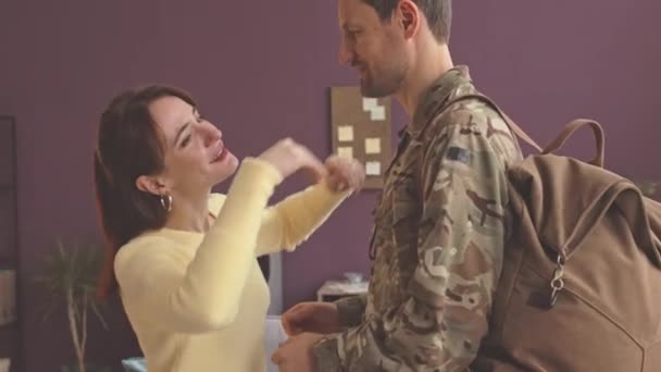 Happy Young Caucasian Woman Meeting Her Long Awaited Soldier Husband — Stok Video