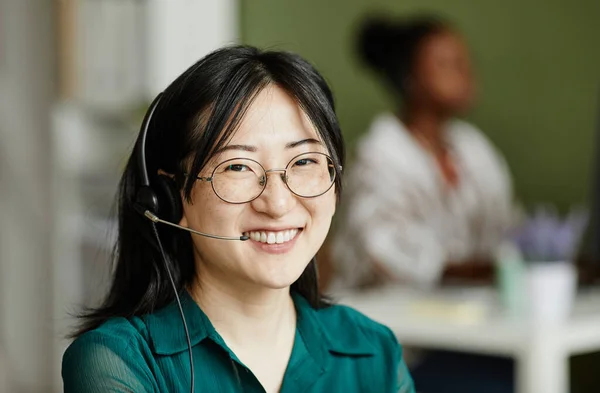 Portrait Asian Young Operator Headphones Eyeglasses Smiling Camera Her Work — Stock Photo, Image