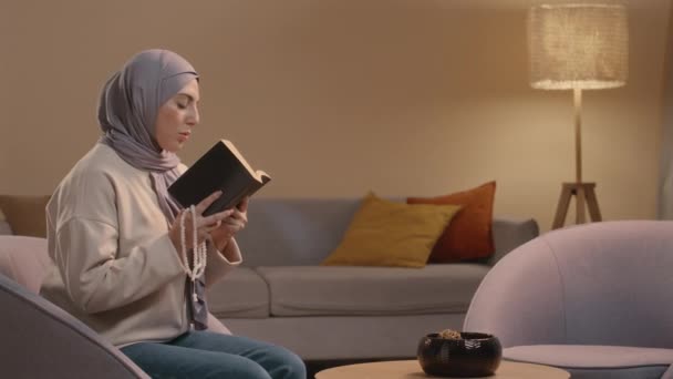 Medium Shot Young Muslim Woman Wearing Hijab Sitting Chair Cozy — Stock Video