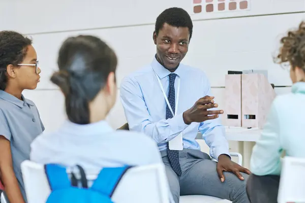 Portrait Smiling Male Therapist Leading Support Group Session Children — Stock Photo, Image