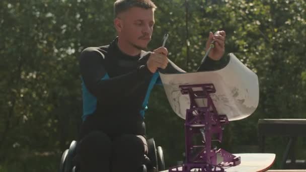 Medium Shot Athletic Young Man Wetsuit Sitting Wheelchair While Fixing — Stock Video