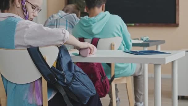 Caucasian Preteen Schoolgirl Taking Stationery Out Her Bag While Sitting — Stock Video