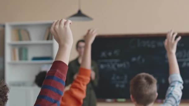 Multiethnic Preteen Students Raising Hands Solve Math Equation Blackboard Lesson — Stock Video