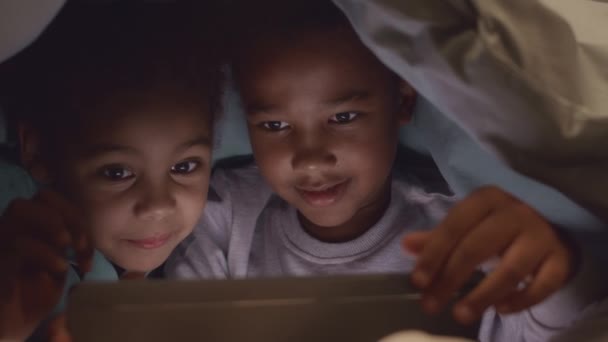 Medium Closeup African American Tween Brother Sister Looking Digital Tablet — Stock Video