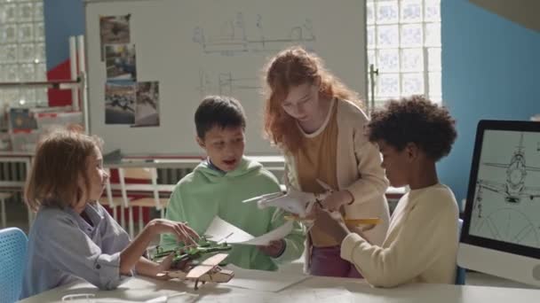 Medium Shot Group Young Diverse Schoolchildren Chatting While Crafting Plane — Stock Video
