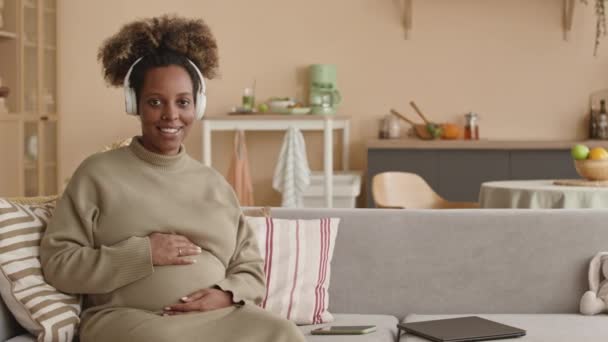 Medium Portrait Young Black Pregnant Woman Wearing Wireless Headphones Posing — Stock Video