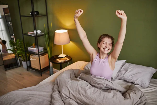 Young Girl Stretching Her Arms Smiling While Waking Morning Bed Royalty Free Stock Photos
